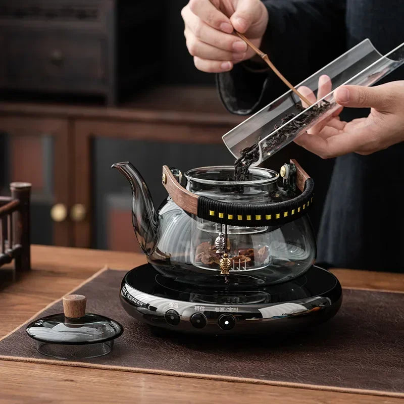 Small Glass Kettle Tea Set with Steaming Teapot and Electric Clay Stove