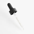 Clear dropper bottle with black cap on a light gray background